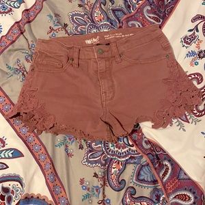 Denim high-rise rose colored jeans with floral patterns in excellent condition